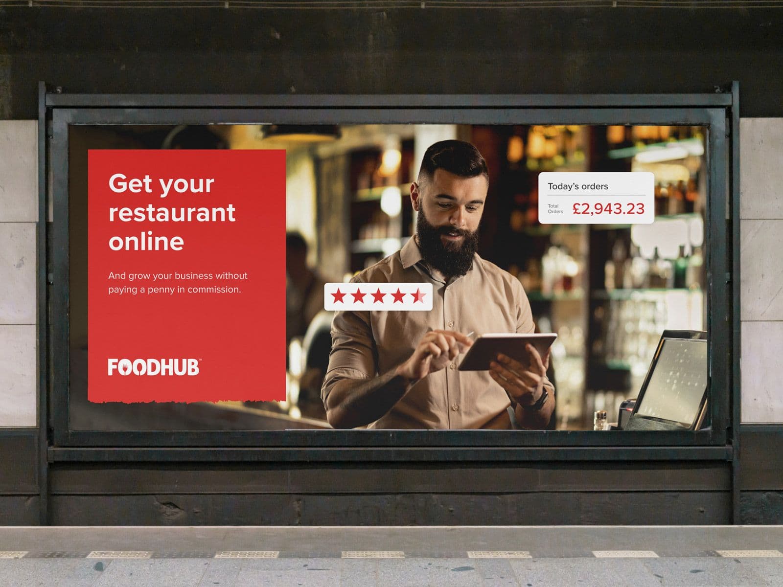 OOH advert for Foodhub, with the title Get your Restaurant online. A restaurant owner can be seen using an iPad.