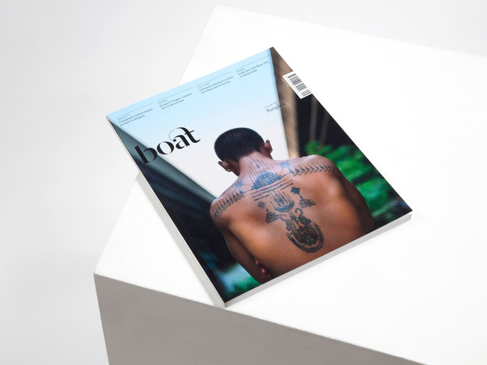 An issue of travel magazine Boat resting at an angle.